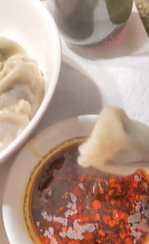 Handmade dumplings with house chili oil